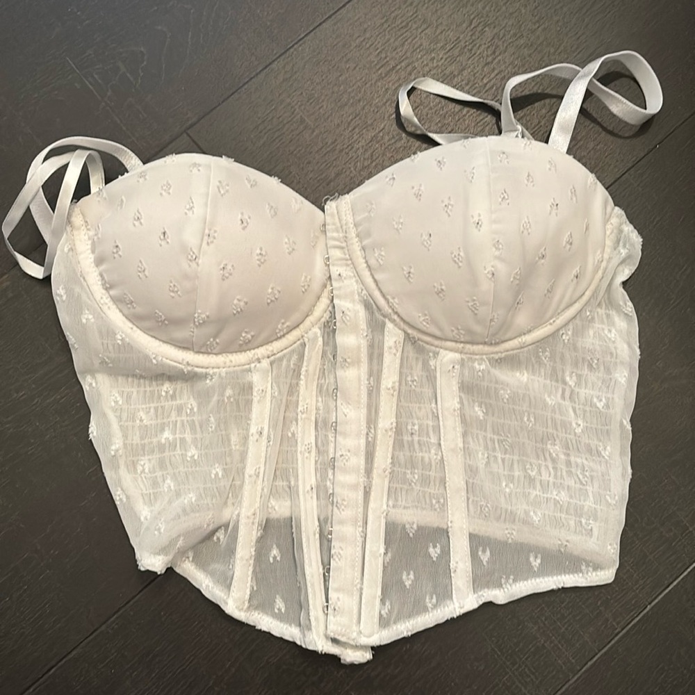 White corset top with heart engravings in the stitching